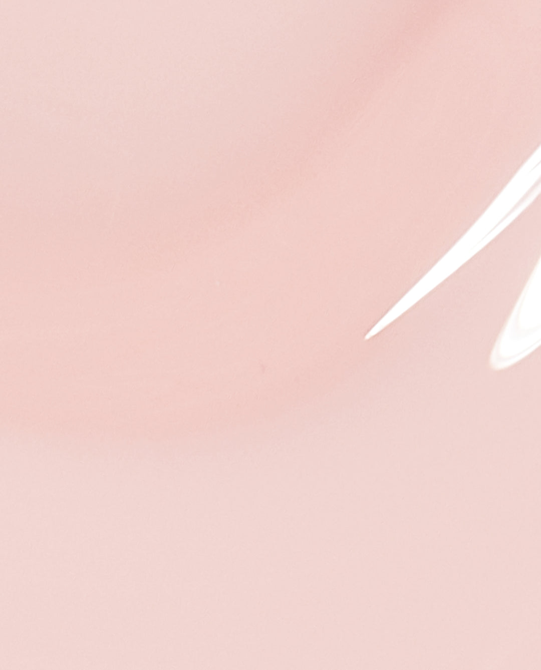 Soft blush-pink OPI Put it in Neutral nail lacquer swatch pooling in a smooth, glossy layer, showcasing the sheer neutral shade and shiny finish for an elegant nail polish gift set option.